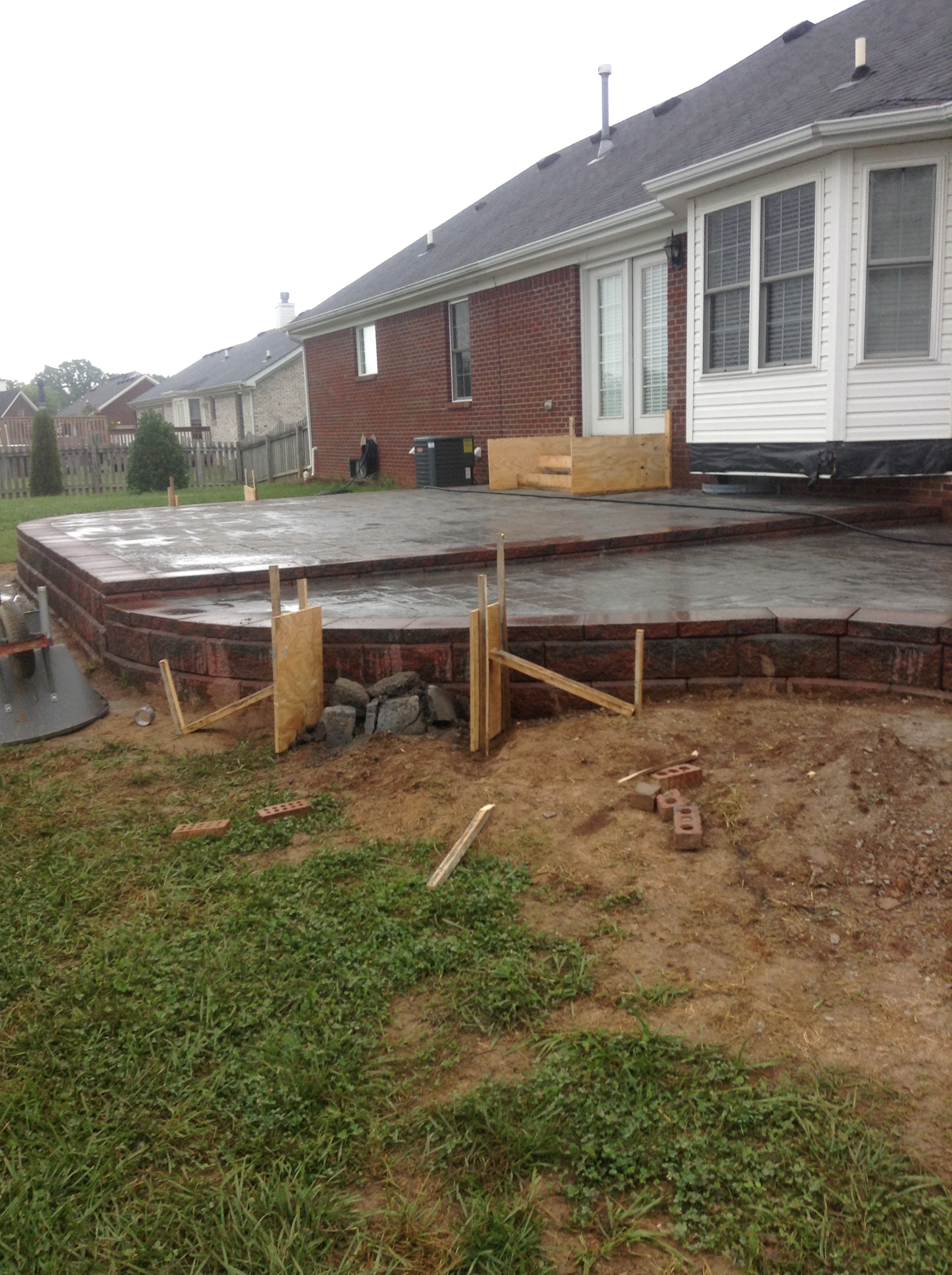  wall with stamped concrete patio